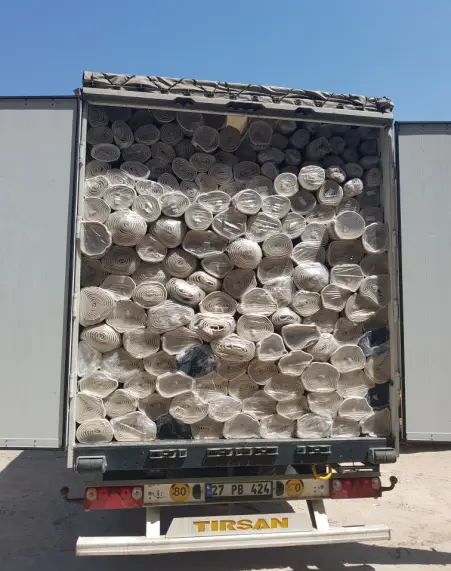 Carpet Rugs Bulk Shipment Truck Loading.png